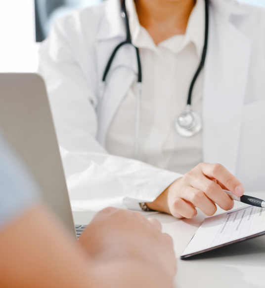 Healthcare provider reviewing medical record with patient